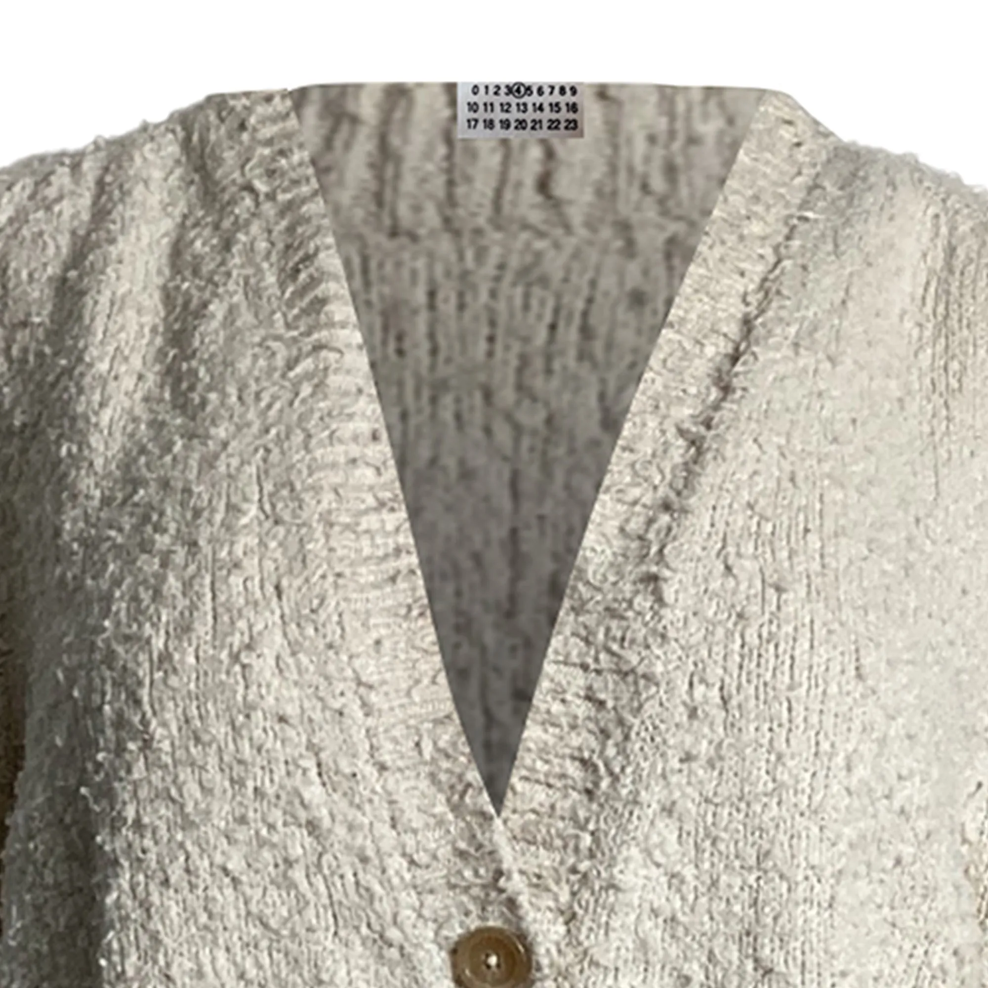 Cardigan tricoté effet bouloche en coton crème Maison Margiela