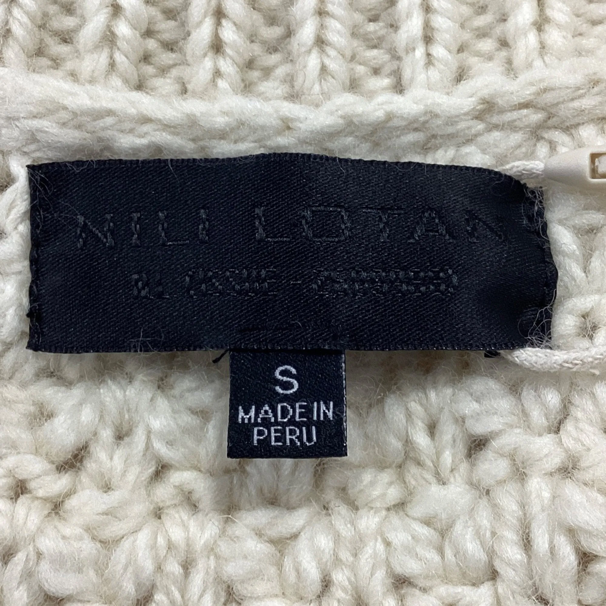 Pull col roulé en laine crème à motif câble Hawthorne de Nili Lotan
